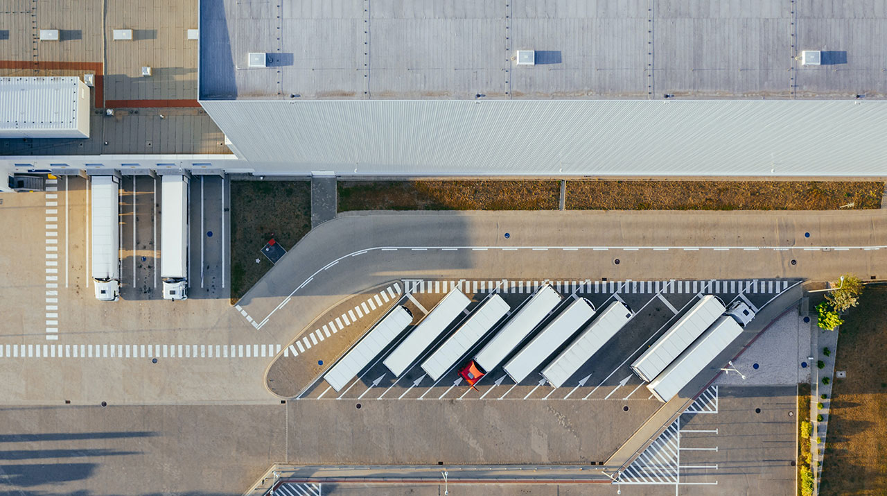 Aerial view of a row of trucks in frontf  oa factory that fiberglass sale in the United States and Mexico.
